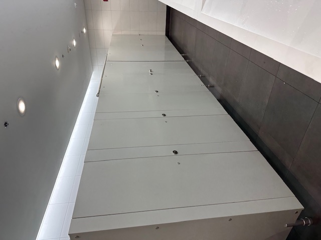 Miami International Airport restroom with Privacy Systems LINEA RETTA partitions